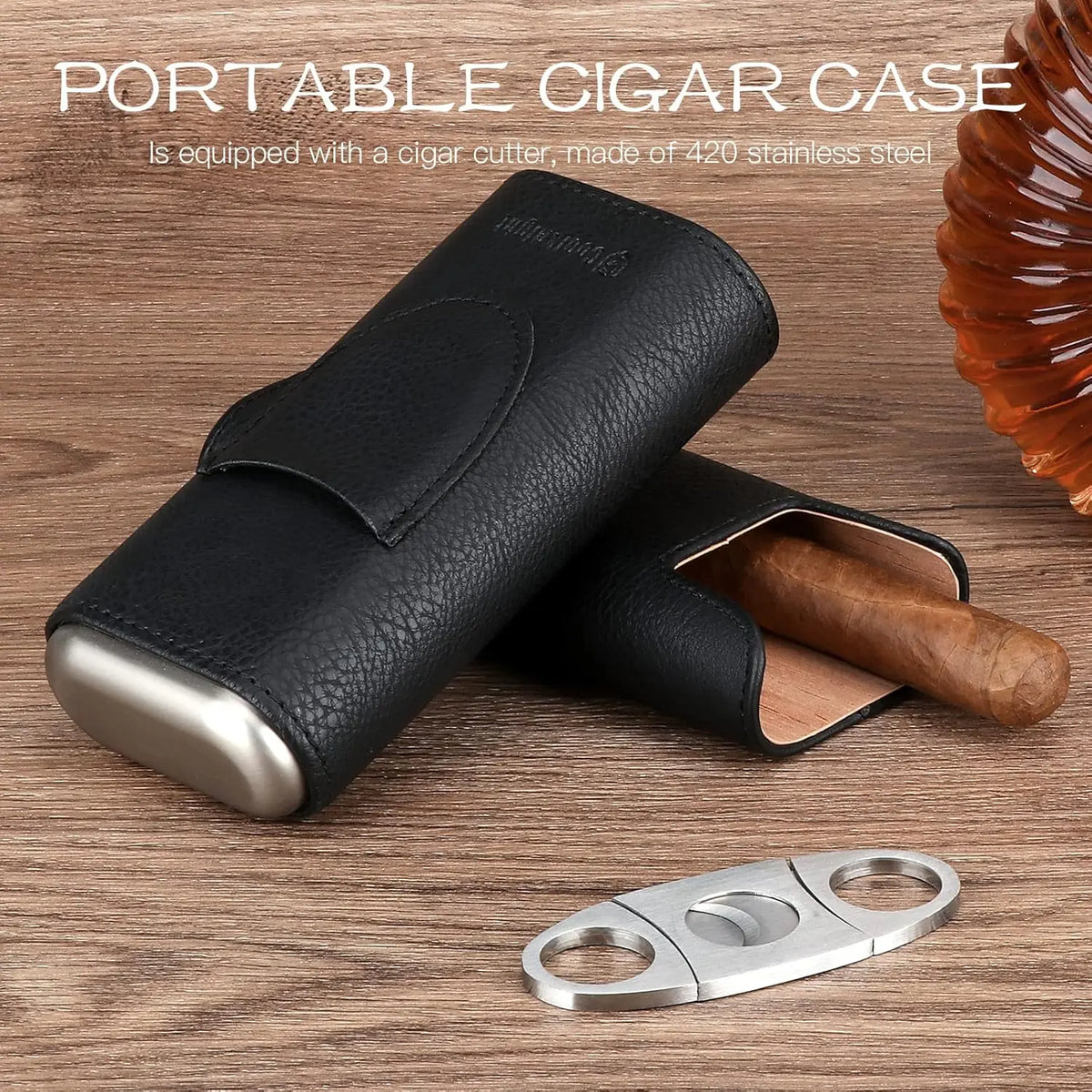 Three cigars laid in cedar-lined leather travel humidor case, ring gauge 60