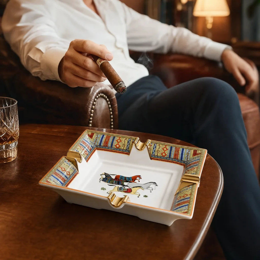 Scotte ceramic cigar ashtray in use on a wooden side table with a lit cigar resting in one slot