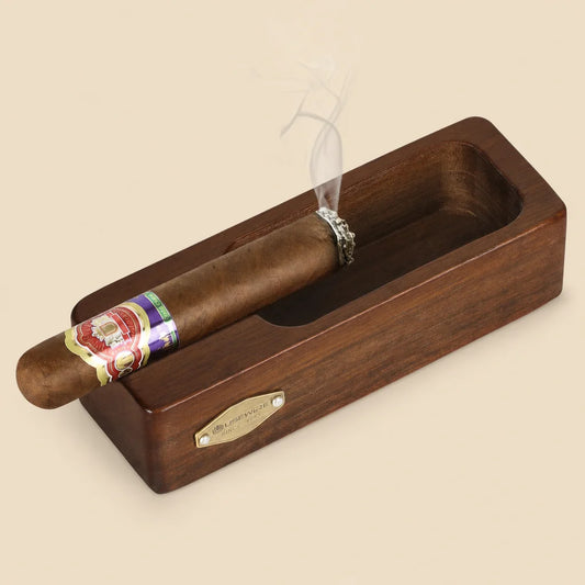 Wooden cigar ashtray with gold logo accent, brown solid wood finish, front view