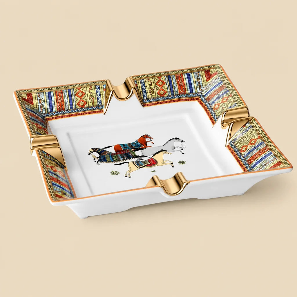 Scotte ivory ceramic cigar ashtray with four slots and gold trim, top view