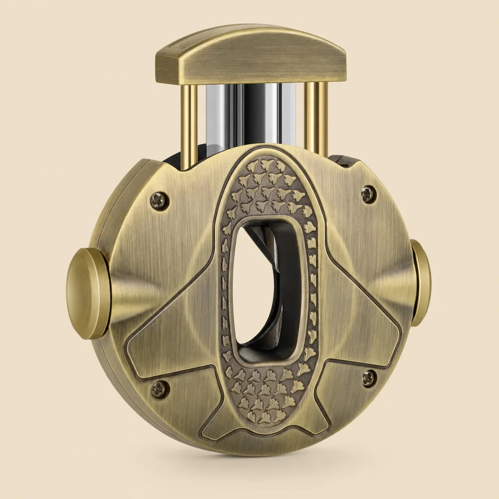 3-in-1 V-cut cigar cutter in gold stainless steel, front view showing round ergonomic body