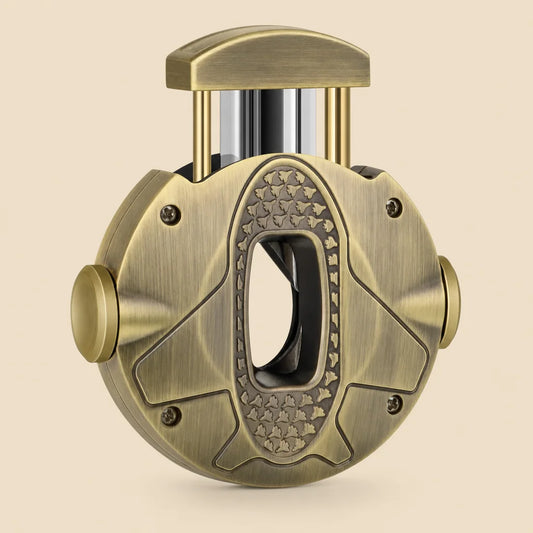 3-in-1 V-cut cigar cutter in gold stainless steel, front view showing round ergonomic body